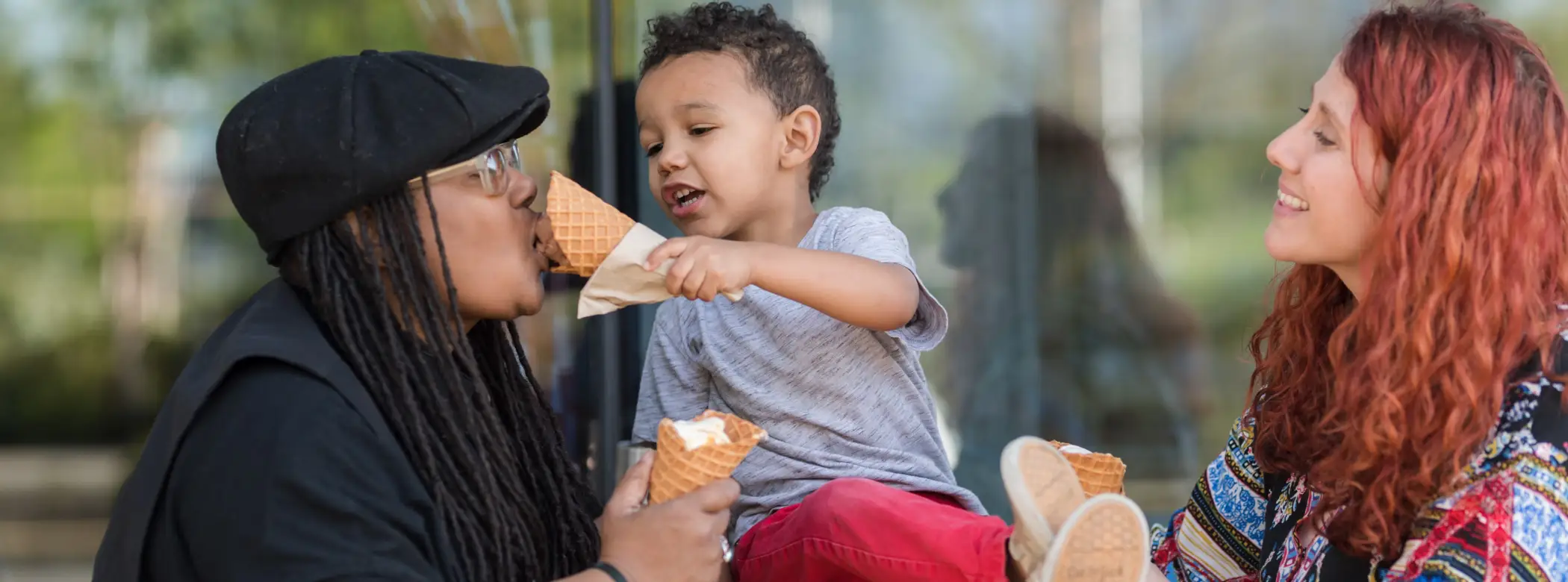 Child feeding mom ice cream