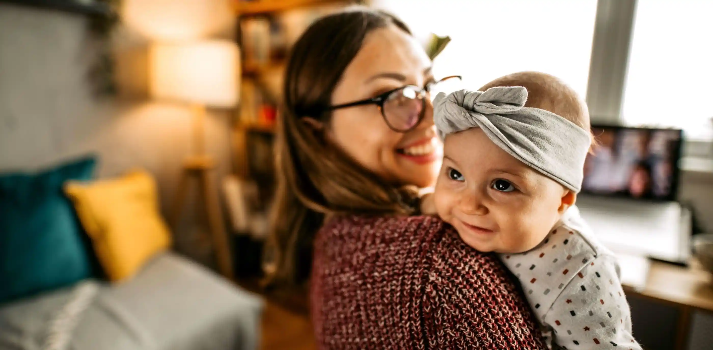 Happy mother holding her baby